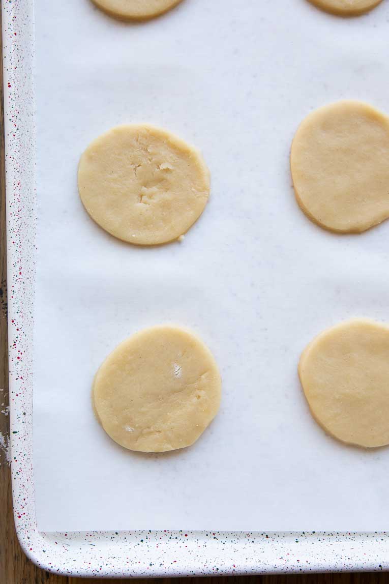 Gluten-Free Christmas Sugar Cookies cut out and placed on baking sheet.