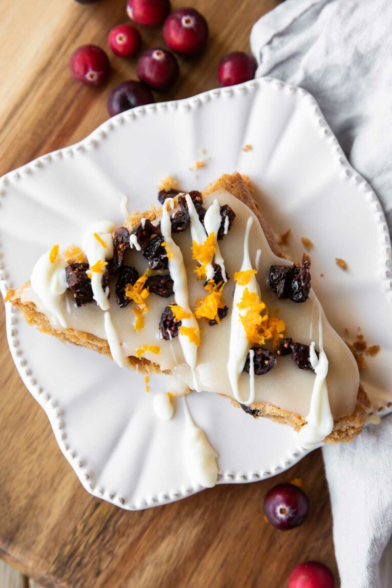 Top photo of Gluten-Free Cranberry Bliss Bar with white chocolate drizzle.