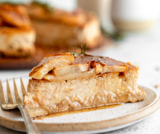 Across photo of slice of Honey Pear Ginger Cheesecake on a plate.