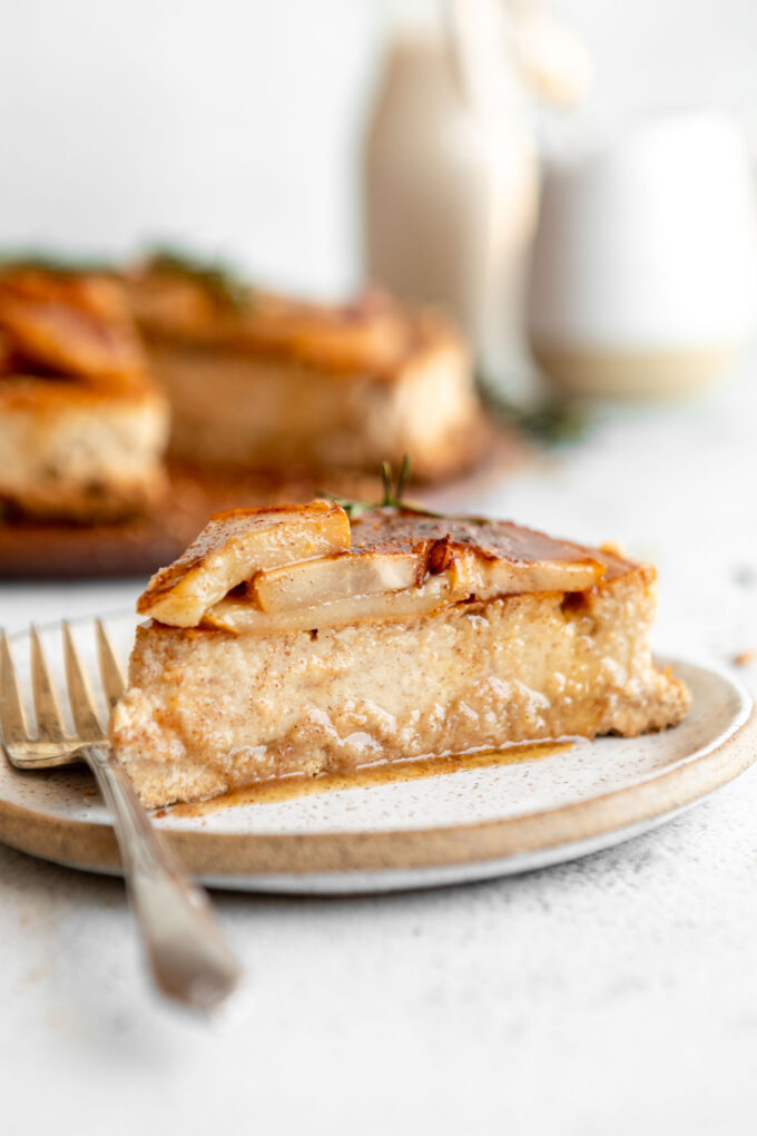 Across photo of slice of Honey Pear Ginger Cheesecake on a plate.