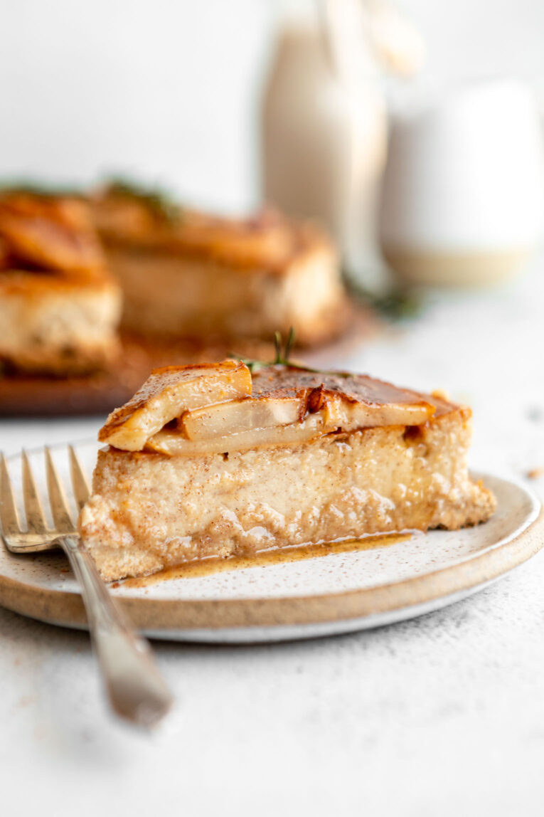 Across photo of slice of Honey Pear Ginger Cheesecake on a plate.