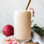 Peppermint Frosty Recipe in a glass with candy canes.