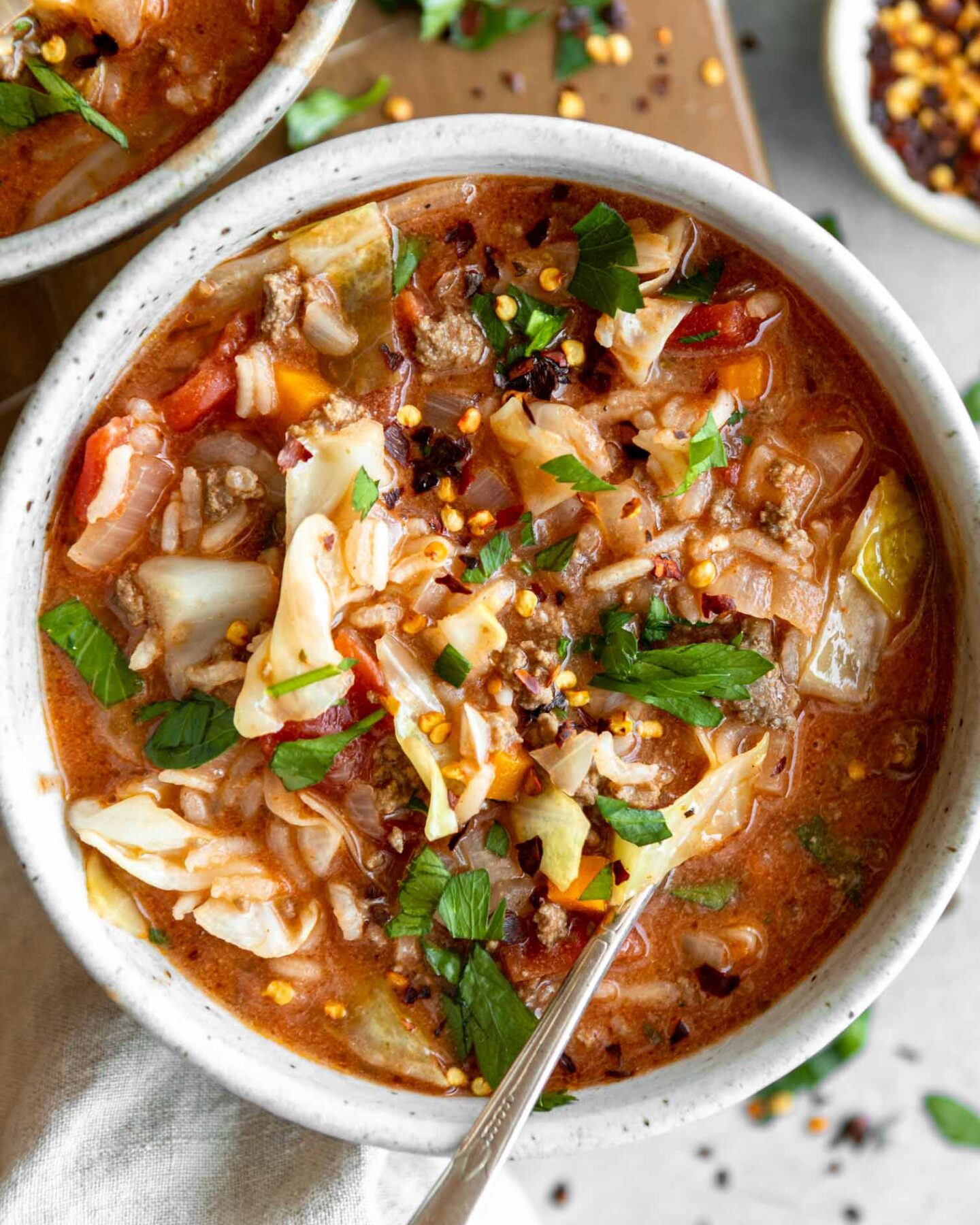 Stuffed Cabbage Soup recipe in a bowl with a spoon.