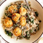 Turkey Sage Meatballs in a dutch oven with parmesan kale orzo.