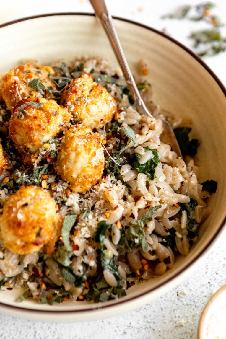 Angled photo of Turkey Sage Meatballs and parmesan orzo.