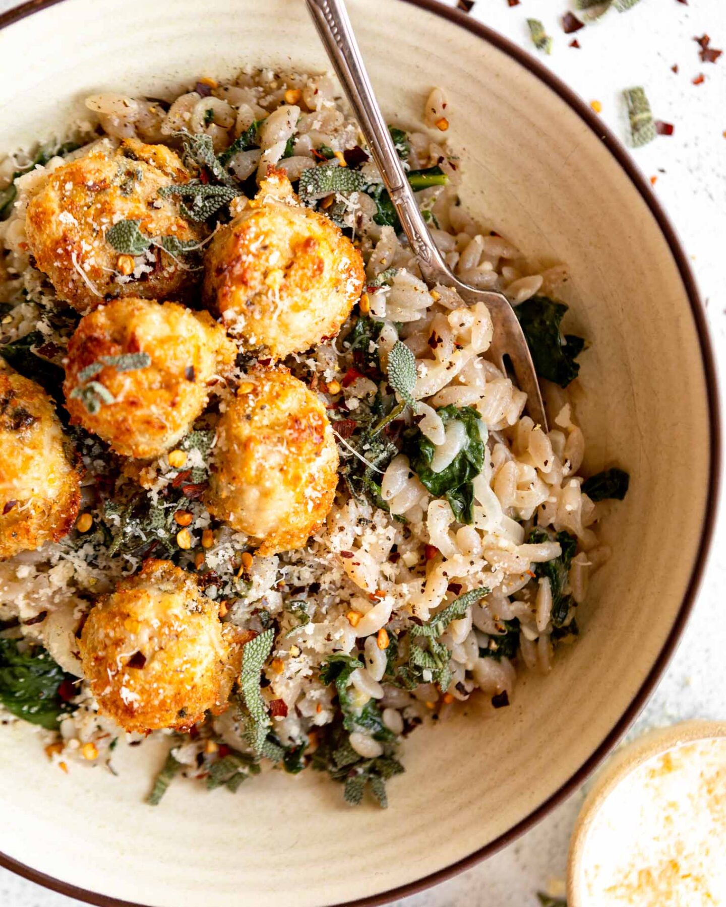 Top shot of Turkey Sage Meatballs recipe over orzo.