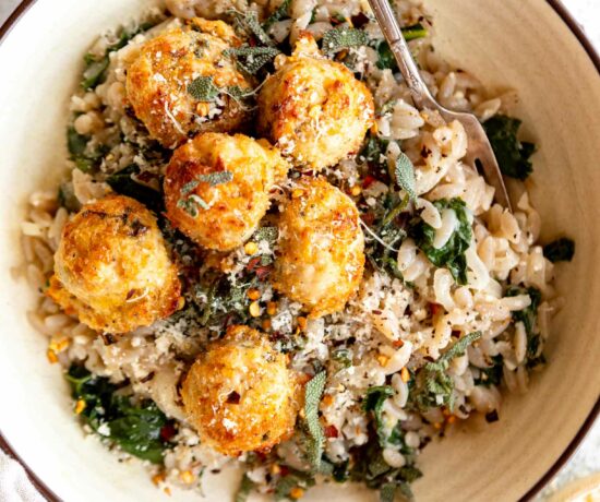 Turkey Sage Meatballs in a dutch oven with parmesan kale orzo.
