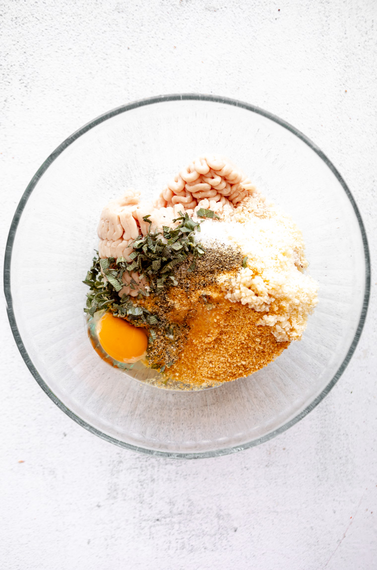 Ingredients for ground turkey meatballs in a mixing bowl.