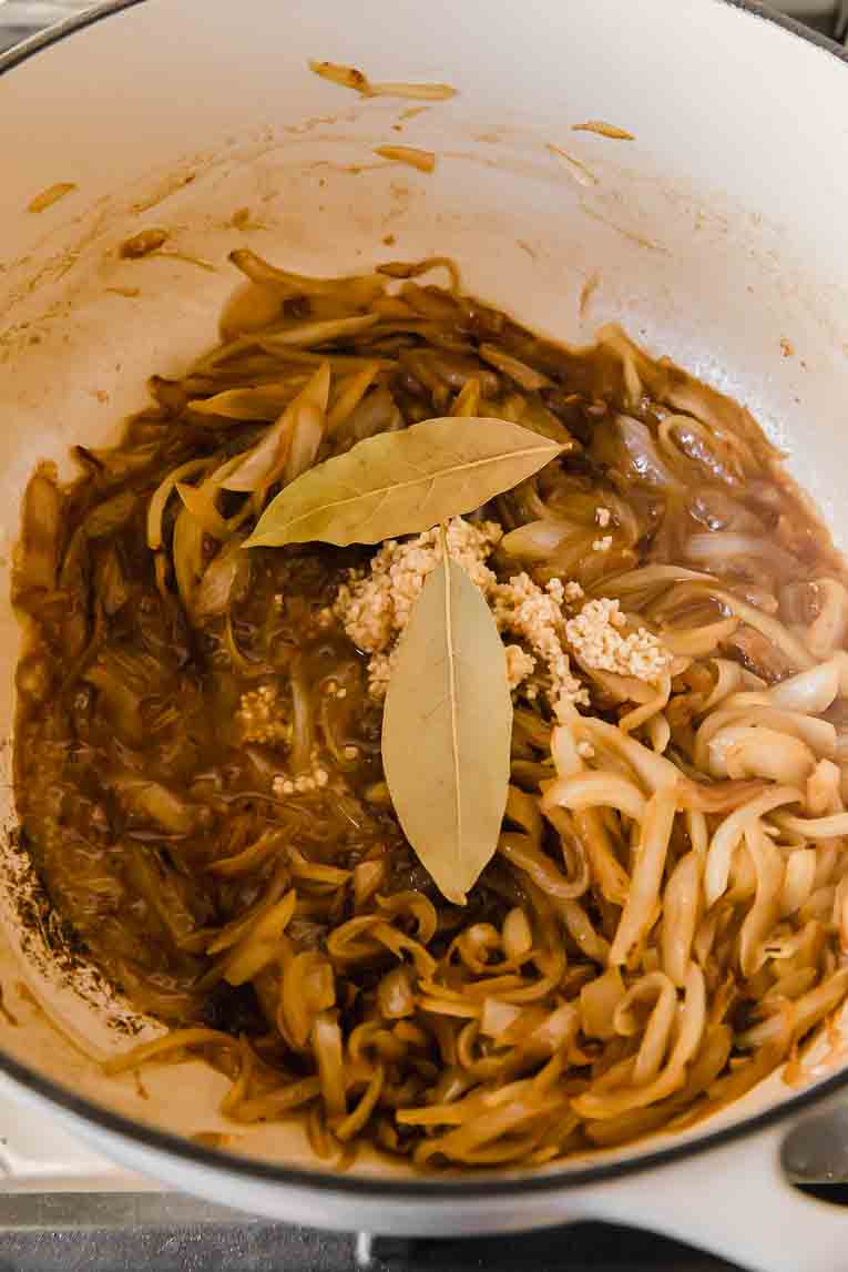 Bay leaves and broth added to Vegetarian French Onions.