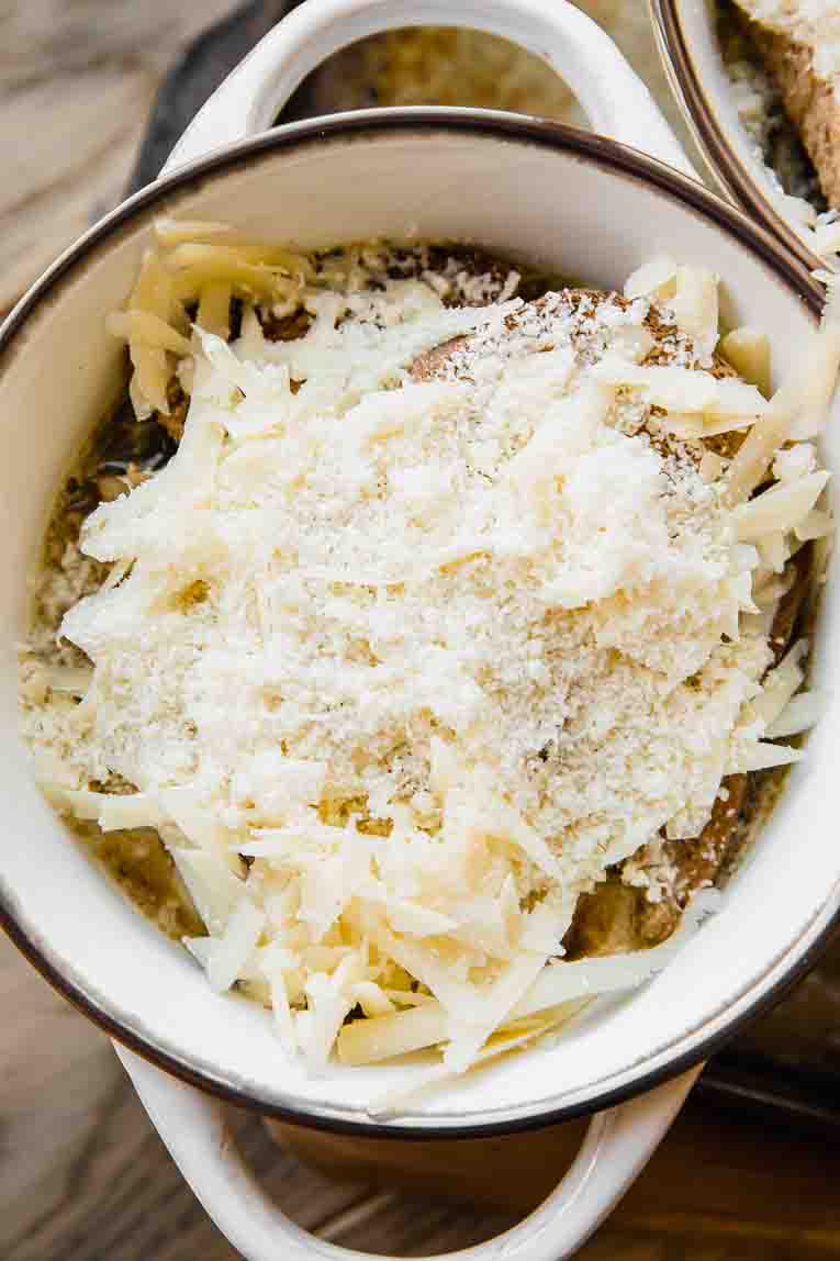 Healthy French Onion Soup topped with cheeses.