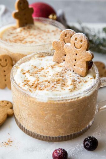 Angled photo of Gingerbread Overnight Oats with yogurt topping in a mug.