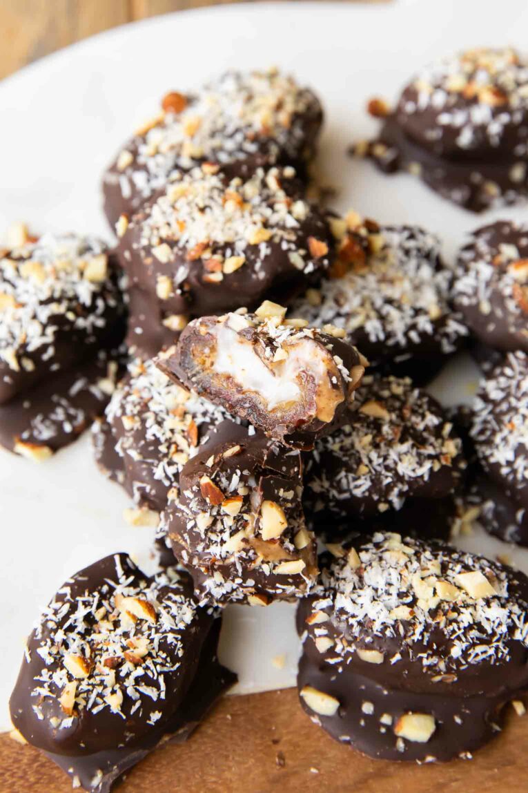 Almond Joy Chocolate Covered Date close up cut in half.