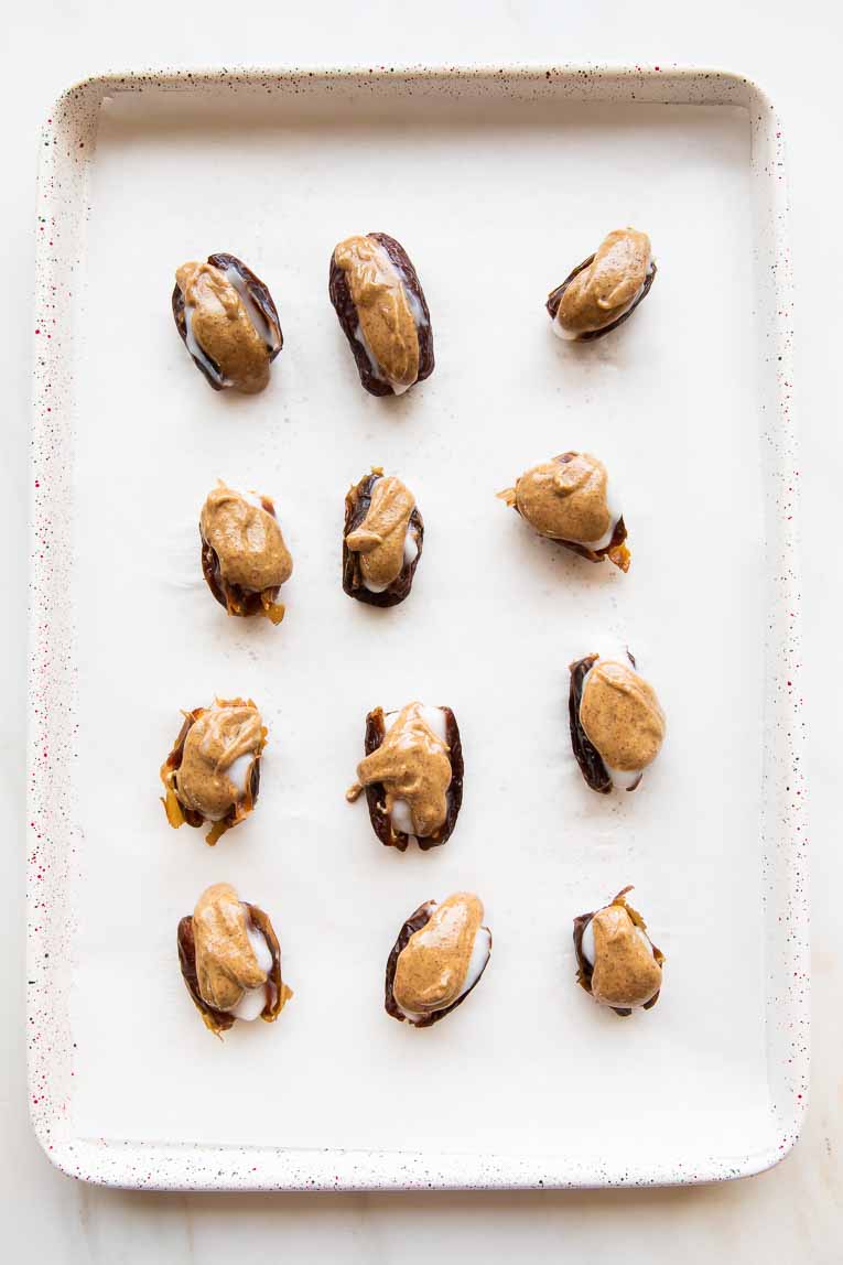 Dates filled with coconut yogurt and almond butter.