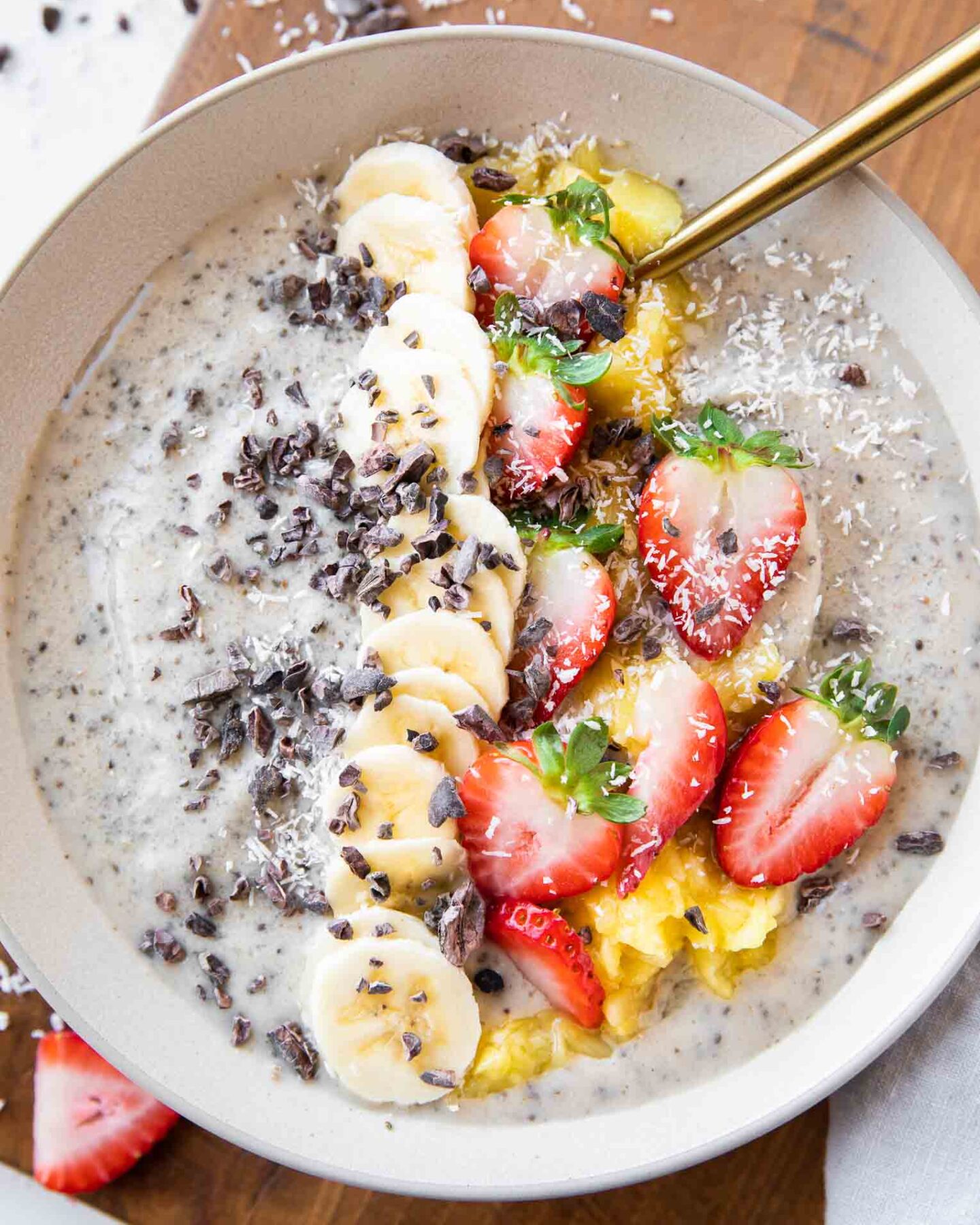 Banana Split Smoothie Bowl with strawberries, cacao, bananas.