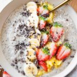 Banana Split Smoothie Bowl with strawberries, cacao, bananas.
