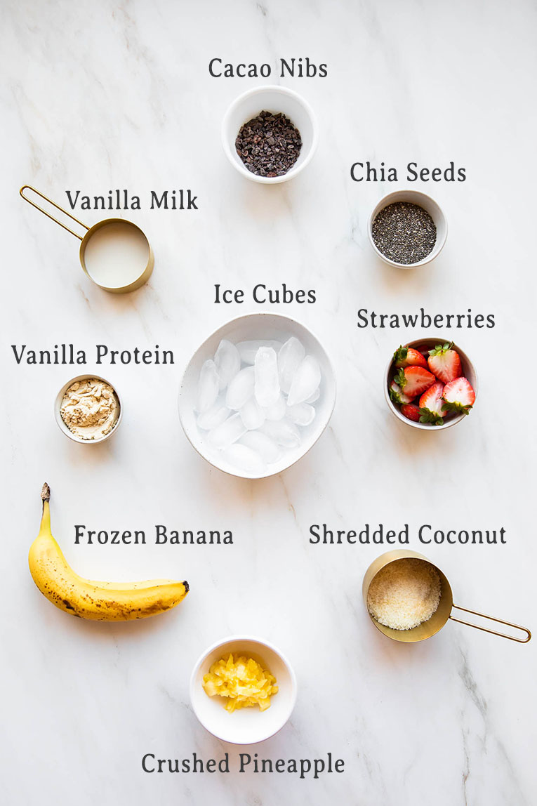 Banana smoothie bowl with banana split toppings ingredients photo.