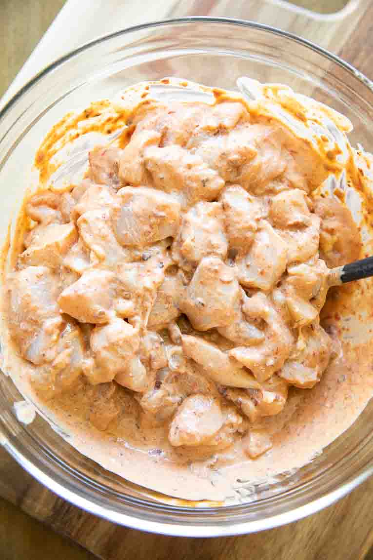 chicken cubes being marinated.