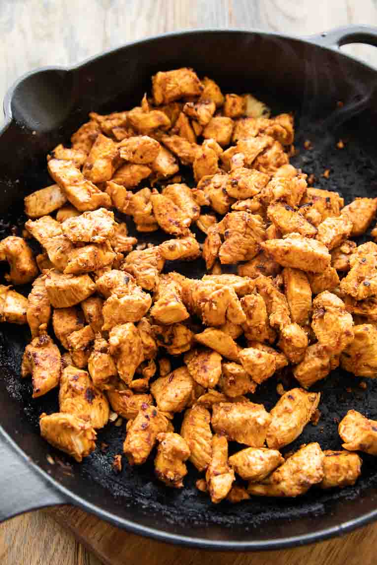 Spicy chipotle chicken cooked in a skillet.