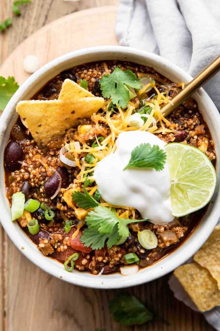 Easy Quinoa Chili recipe in a bowl with a spoon.