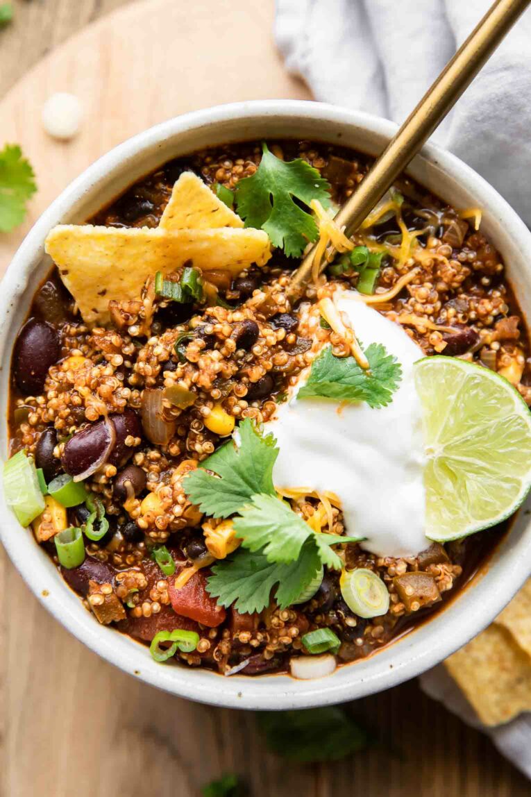 Spoon in a bowl of quinoa chili.