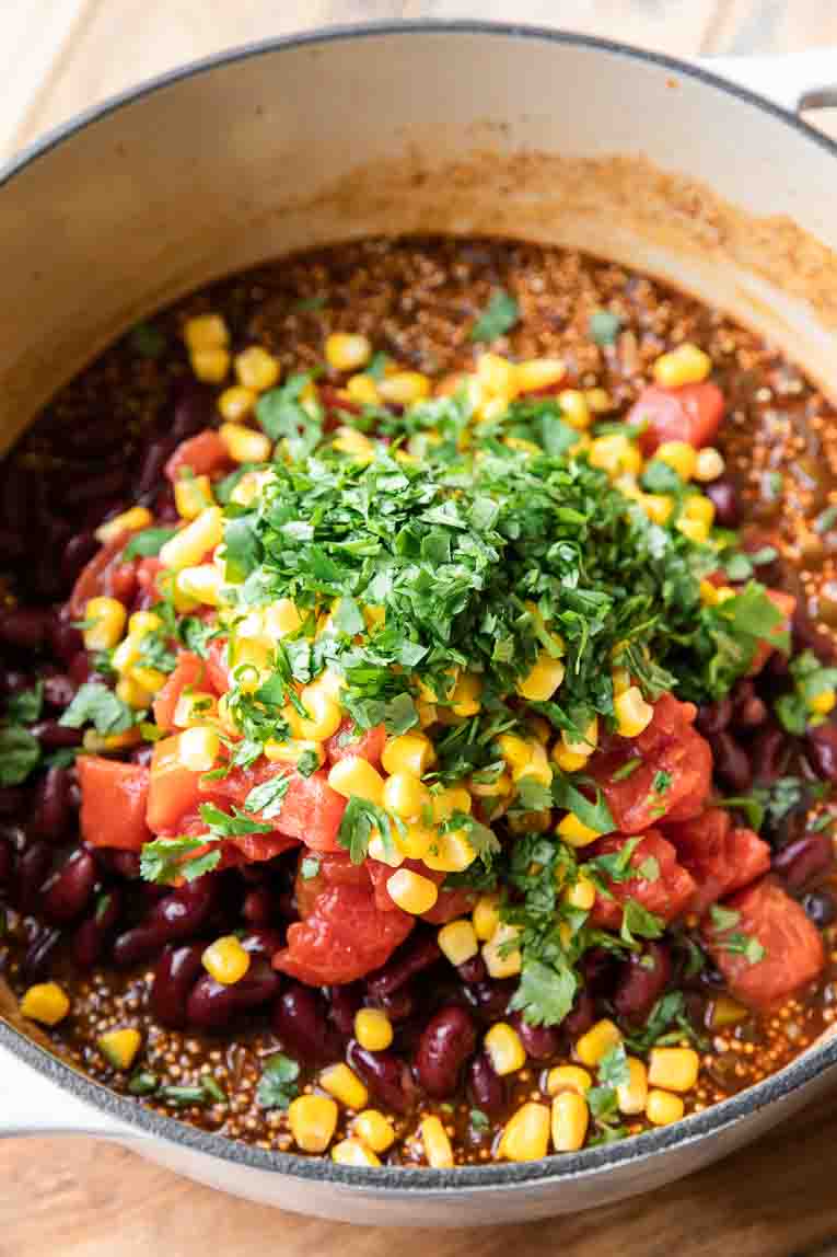 corn, beans, and tomatoes added to quinoa chili.