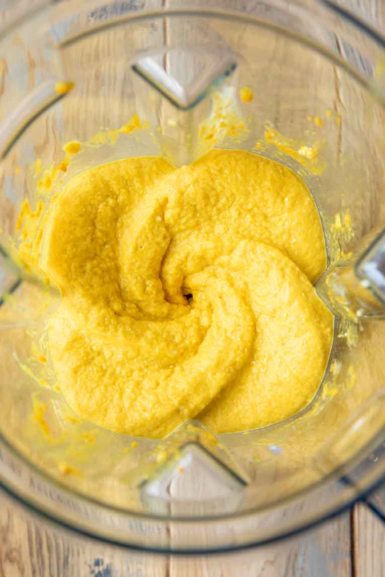 Pineapple turmeric smoothie blended in a Vitamix.