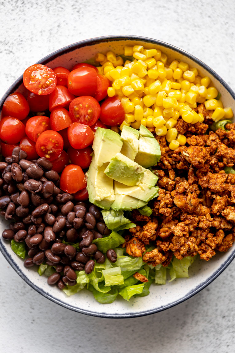 Layered bowl of ground turkey taco salad.