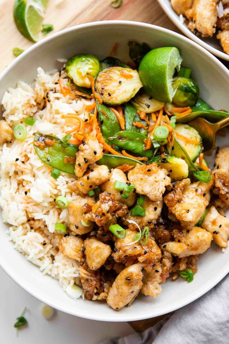 Close up of Honey Sesame Chicken Meal Prep Bowl with rice and veggies.