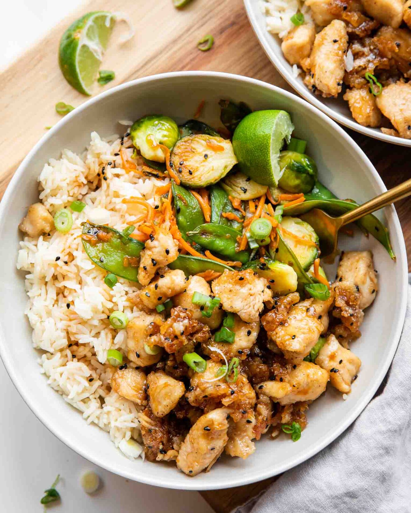 Healthy Honey Sesame Chicken in Meal Prep Bowls.