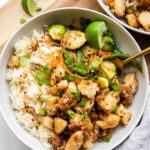 Healthy Honey Sesame Chicken in Meal Prep Bowls.
