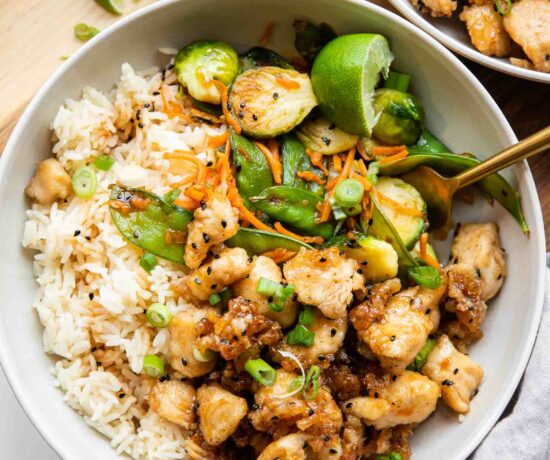 Healthy Honey Sesame Chicken in Meal Prep Bowls.