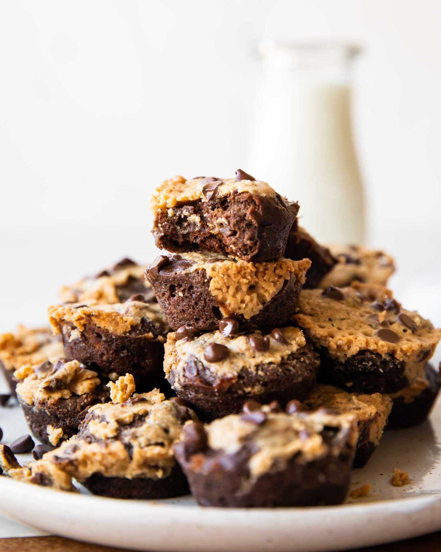Protein Brownie Bites recipe across photo stacked on plate.