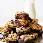 Protein Brownie Bites recipe across photo stacked on plate.