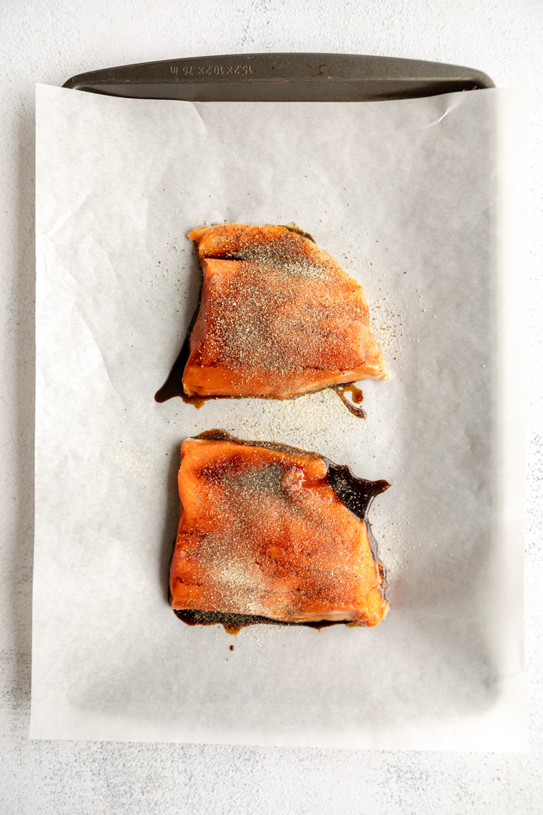 Sushi filets being baked on a sheet pan.