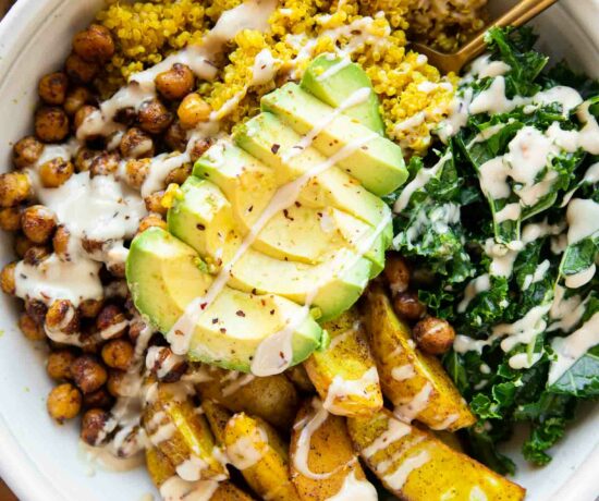 Vegan Turmeric Quinoa Power Bowl with avocado and dressing.