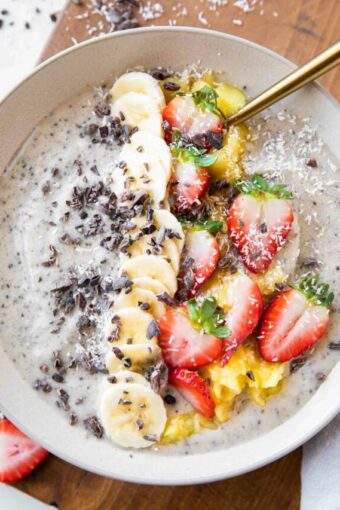 Banana Split Smoothie Bowl with strawberries, cacao, bananas.