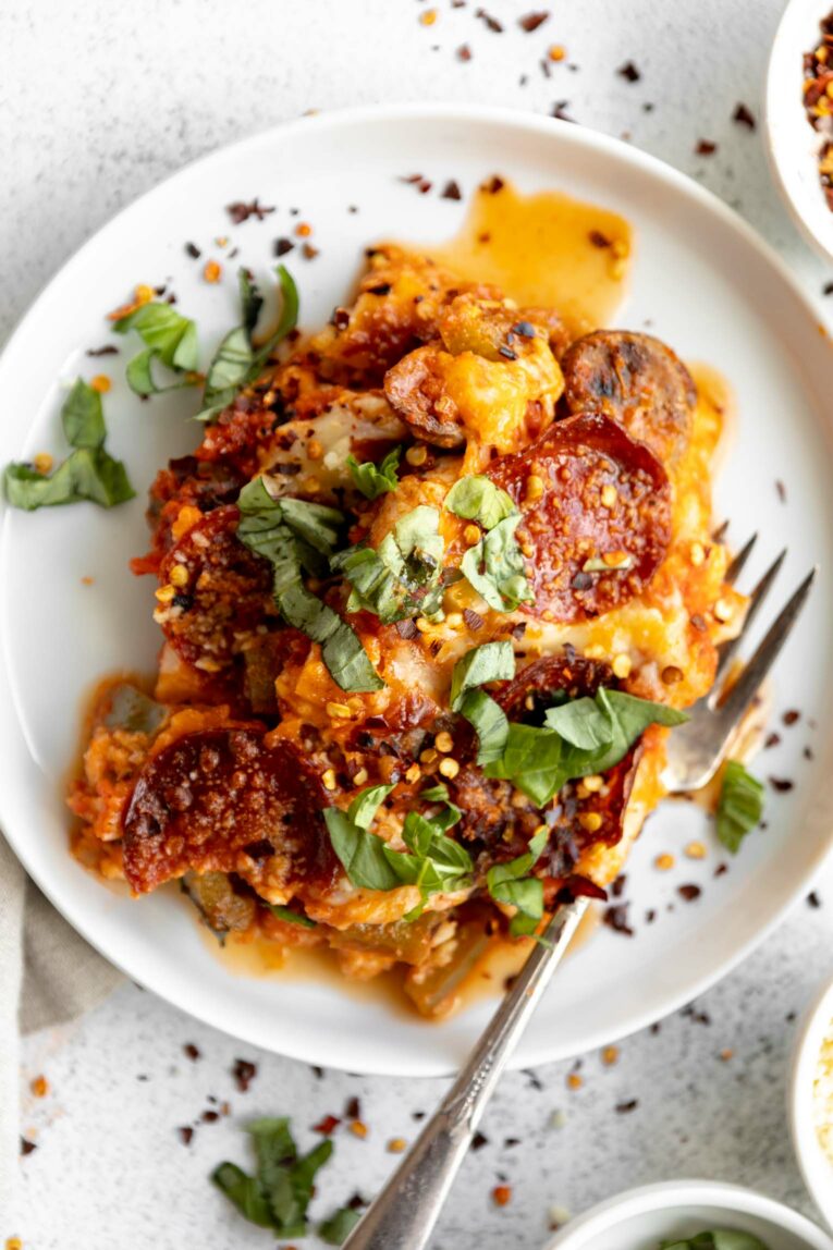 Cauliflower Pizza Casserole plated with a fork.