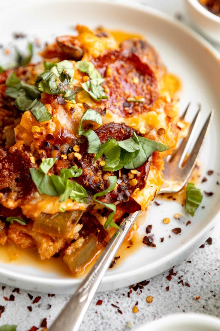 Angled close up of Cauliflower Keto Pizza Casserole on a plate.