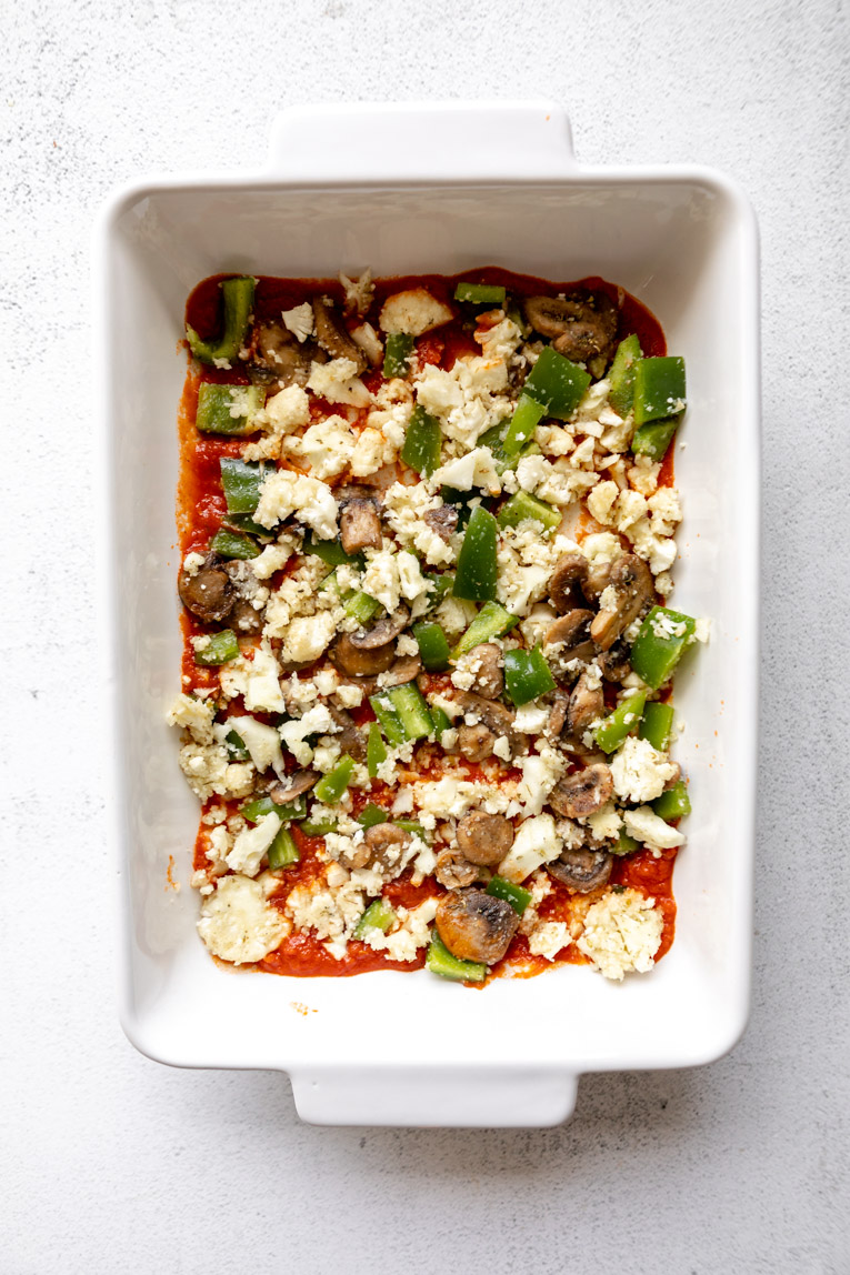 Low-carb marinara sauce and veggies in a casserole dish.