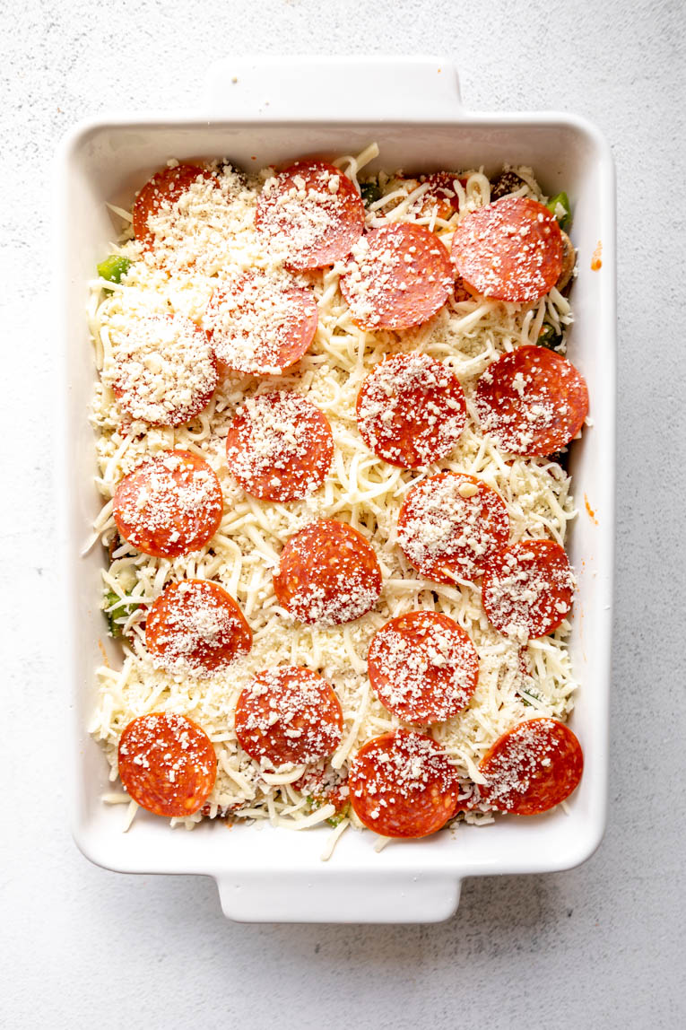 Cauliflower Pizza Casserole layered before baking.