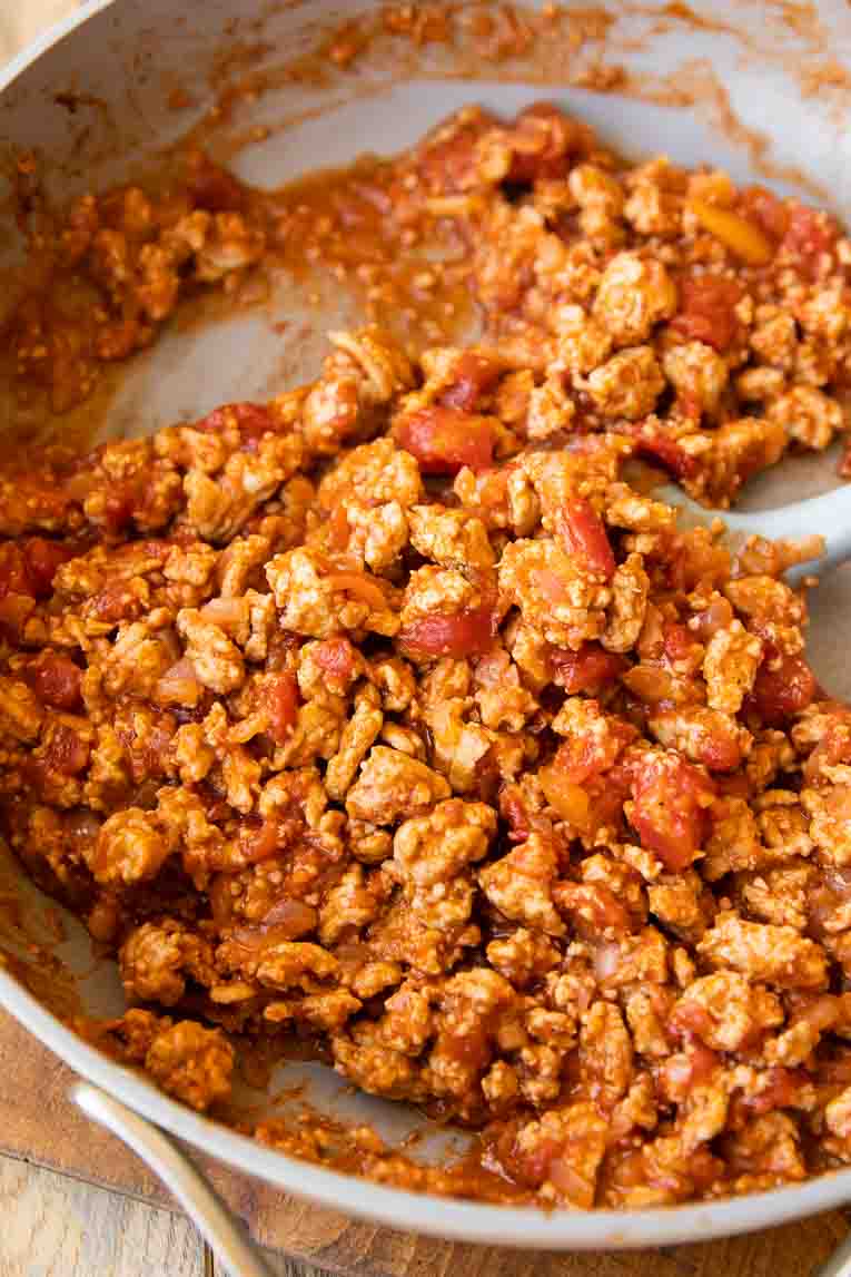 Ground turkey meat sauce being cooked in a pan.