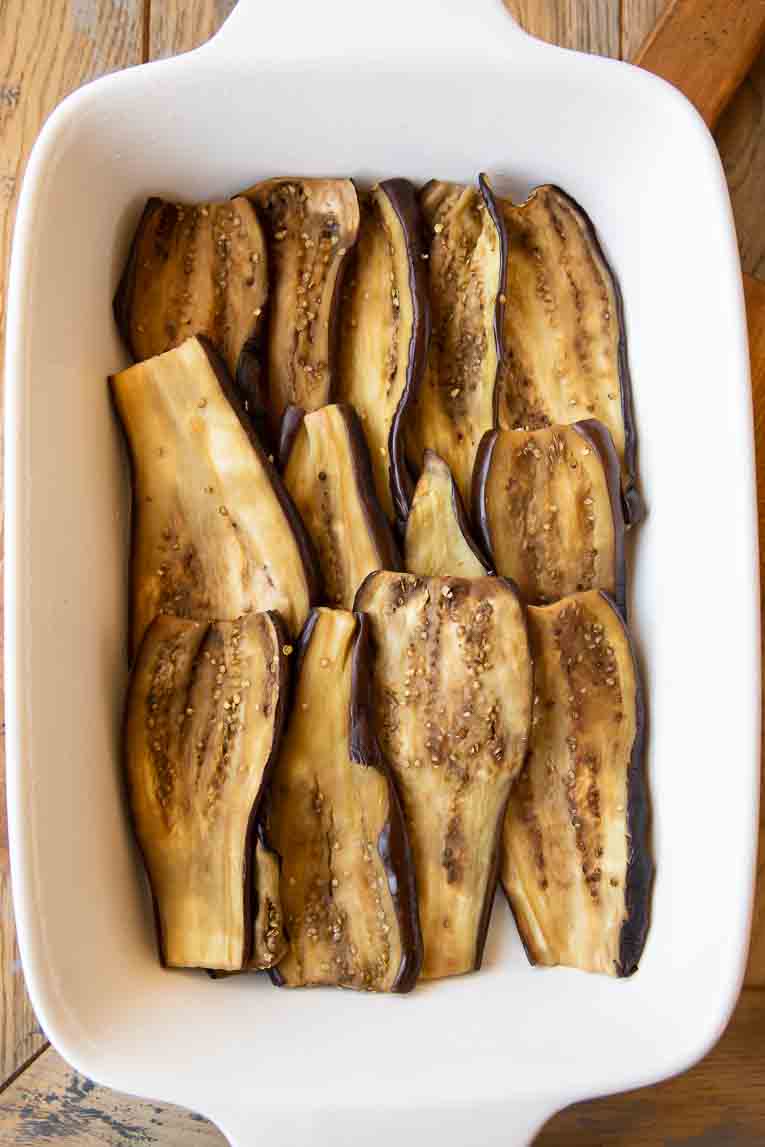 Roasted eggplant in a casserole dish.