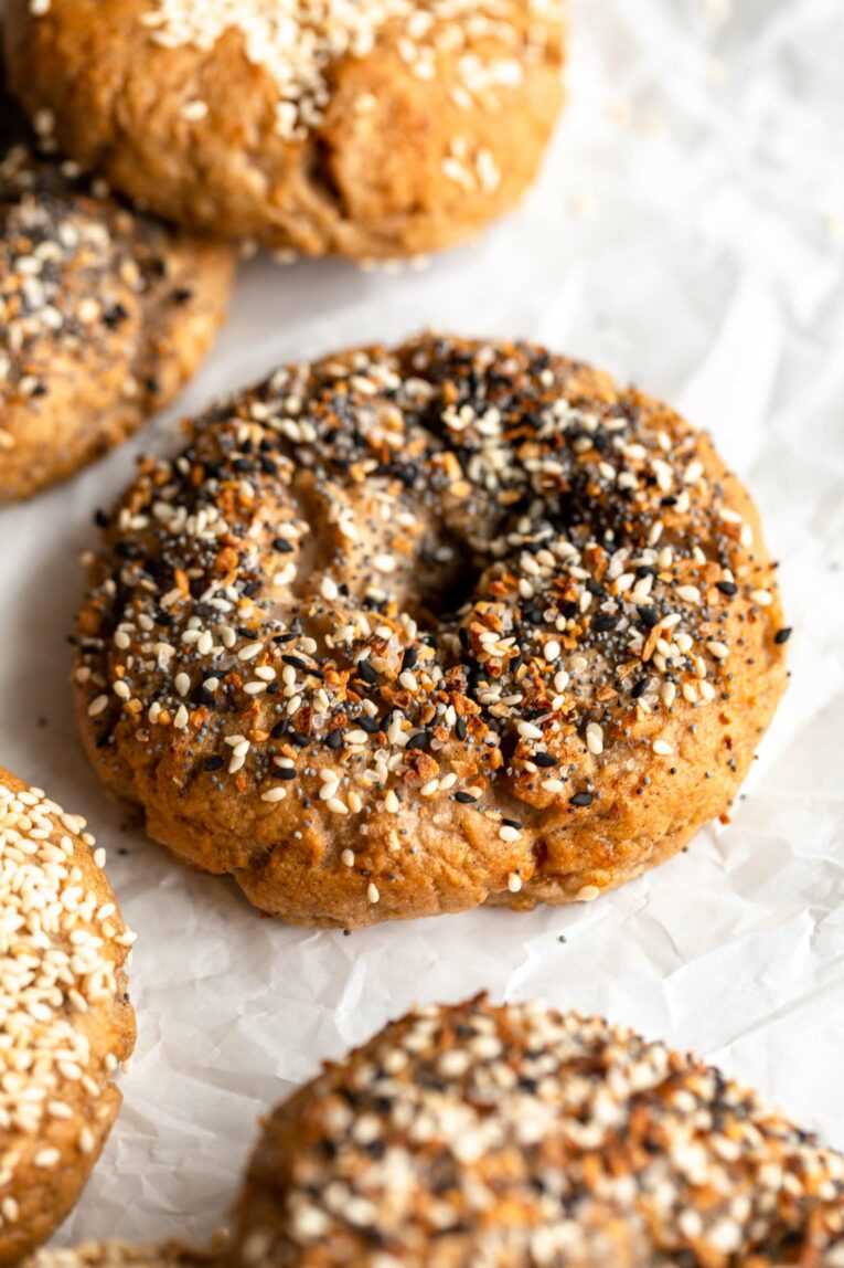 Angled photo of Homemade Gluten-Free Bagels with everything seasoning.