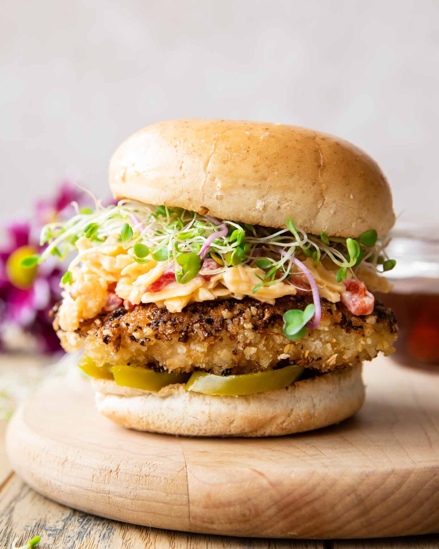 Across photo of a healthy Honey Pepper Pimento Chicken Sandwich recipe.