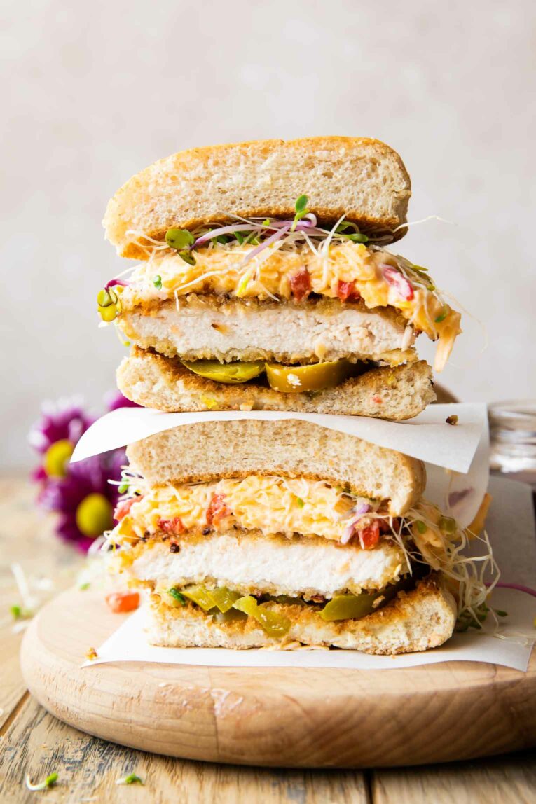 Honey Pepper Pimento Chicken Sandwich cut in half and stacked.