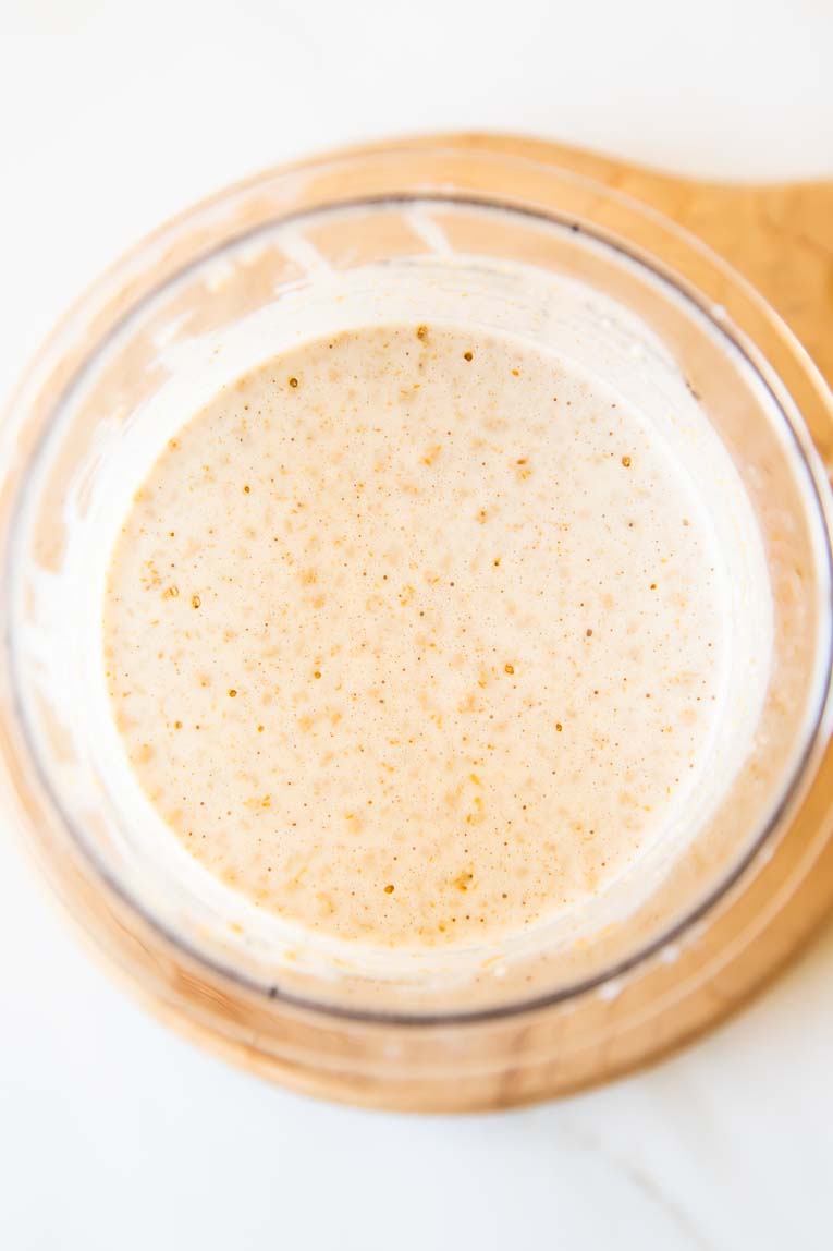 Protein ice cream ingredients whisked together in a pint jar.