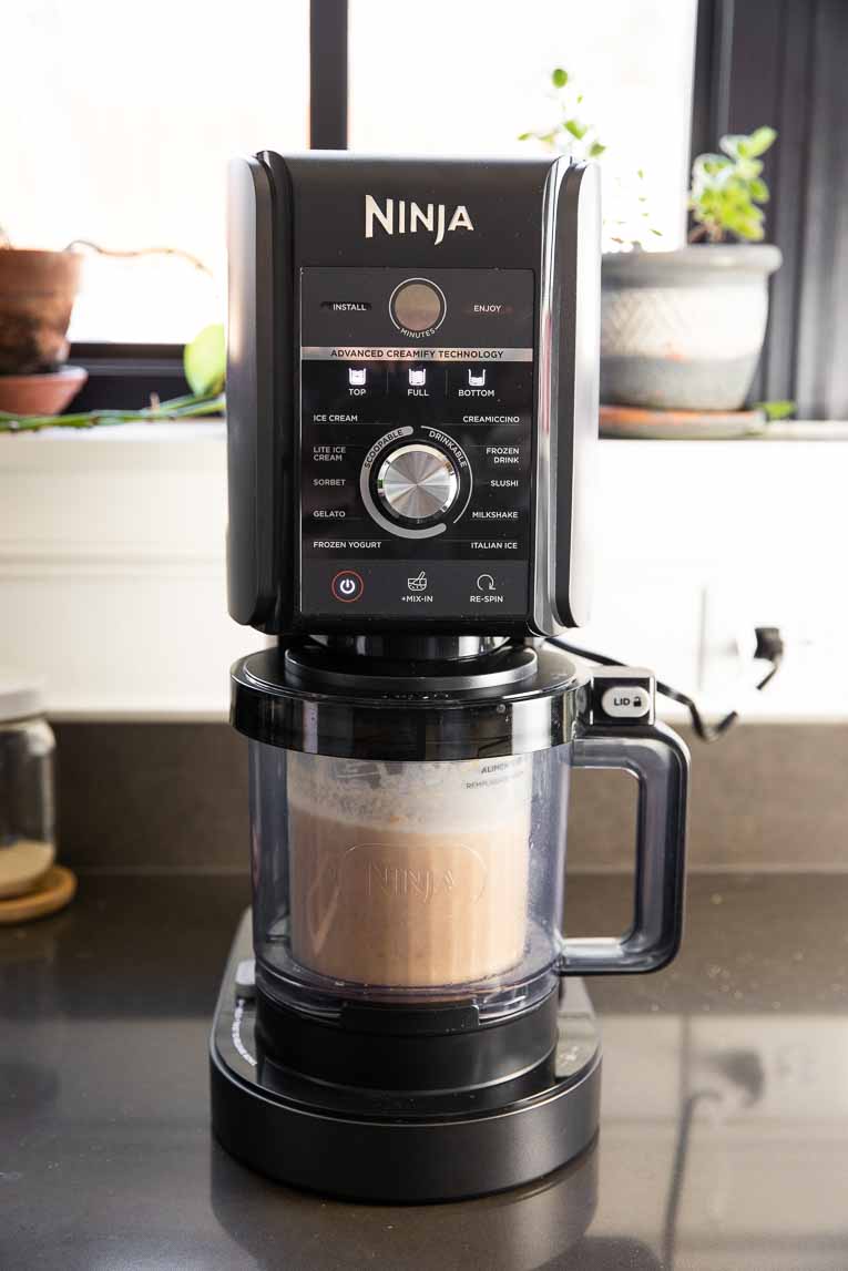 Ninja Creami Deluxe blending ice cream.