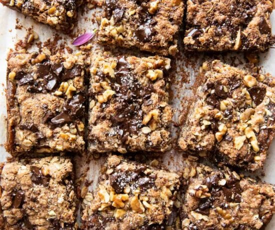 Oatmeal Chocolate Chip Date Bars sliced on a cutting board.