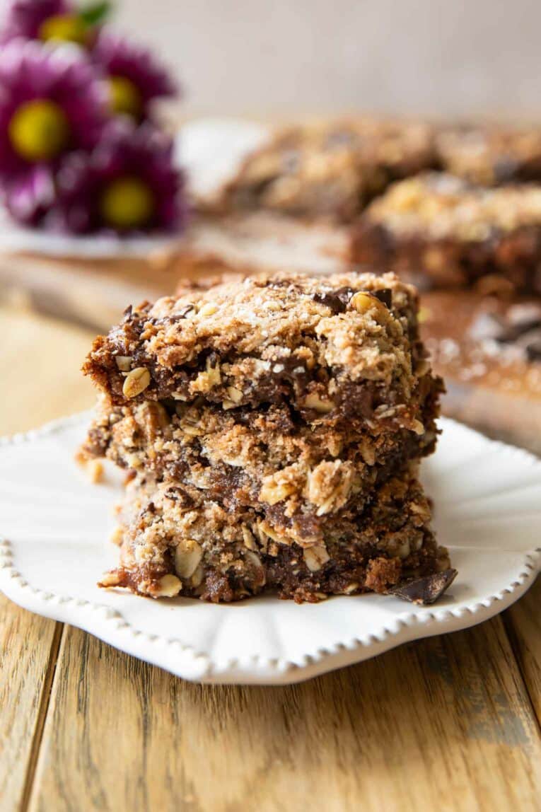 Angled close up of stacked Oatmeal Chocolate Chip Date Bars.