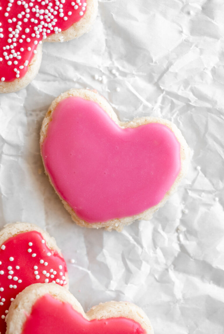gluten free heart shape cookie on parchment paper.